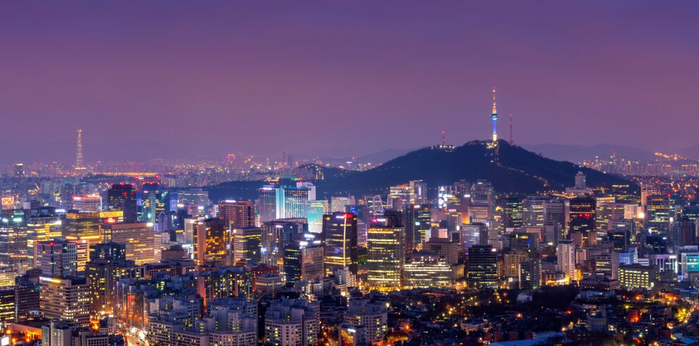 Downtown cityscape at night in Seoul, South Korea.